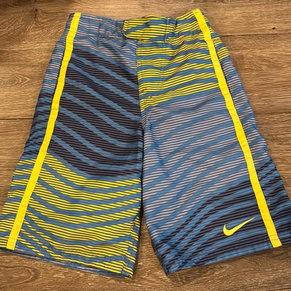 Boys Nike bathing suit trunks size small, blue and yellow pattern
